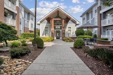 Charlotte apartment for rent - A building with a stone pathway leading to it.