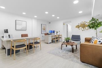 Rockville apartment for rent - a living room with a couch and a table with chairs