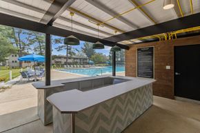 Rockville apartment for rent - a poolside bar in the clubhouse of a resort with a swimming pool
