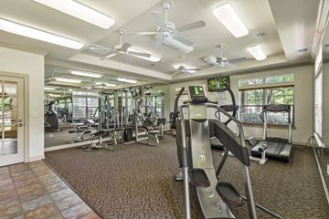 Mesquite apartment for rent - A gym with treadmills, weights, and exercise equipment.