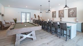 Surf City apartment for rent - a game room with a pool table and a bar