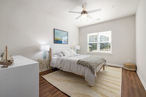 Surf City apartment for rent - a bedroom with a bed and a ceiling fan