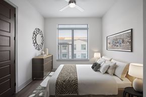 Allen apartment for rent - a bedroom with a large bed and a window