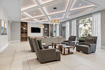 Winter Park apartment for rent - A living room with a grey sofa and a white coffee table.
