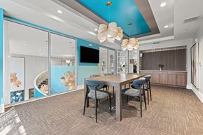 Winter Park apartment for rent - A modern dining room with a wooden table and chairs.