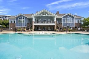 Mooresville apartment for rent - A large house with a pool in front.