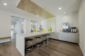 Dallas apartment for rent - A kitchen with a white counter and stools.