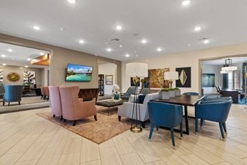 Garland apartment for rent - a living room and dining room with a table and chairs and a tv
