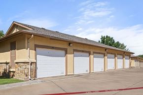 Denton apartment for rent - A building with a row of garage doors.