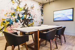 Atlanta apartment for rent - a dining room with a table and chairs and a painting on the wall