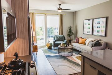 Atlanta apartment for rent - a living room with a couch and a chair
