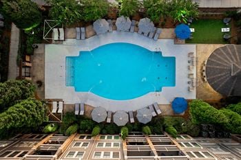Resort-style pool with cabanas
