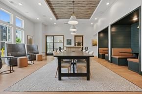 Greensboro apartment for rent - A room with a large table and chairs.