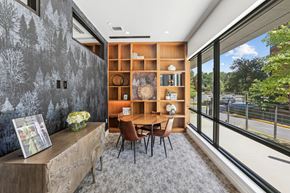 Reston apartment for rent - a dining room with a table and chairs and a large window