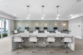 Jacksonville apartment for rent - A conference room with a long table and chairs.