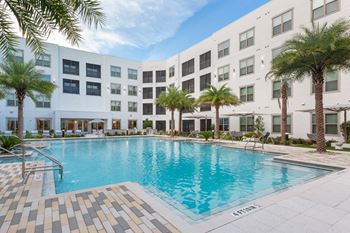 Resort-style pool with sundeck & cabanas & poolside aqua entertaining lounge