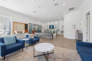 Ashburn apartment for rent - A living room with blue couches and a rug.