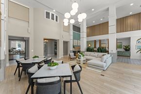 Orlando apartment for rent - A modern dining area with a table set for six.