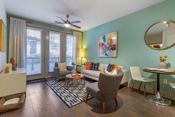 Annapolis apartment for rent - a living room with a couch and chairs and a ceiling fan