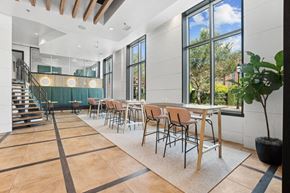 Charleston apartment for rent - a dining room with tables and chairs and large windows