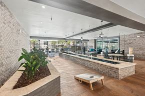 Charleston apartment for rent - the lobby of a building with a reception desk and a seating area