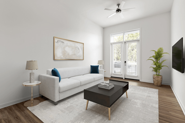 Wilmington apartment for rent - A living room with a white couch, a coffee table, a floor lamp, and a painting on the wall.