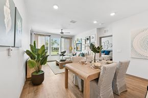 Vero Beach apartment for rent - A dining room with a wooden table and chairs.