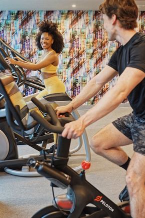 Atlanta apartment for rent - Stock photo of people using the bikes at the fitness center
