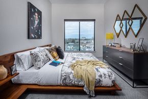 Atlanta apartment for rent - Bedroom with a bed in the foreground and a window on the back wall