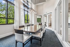 Annapolis apartment for rent - A dining room with a long table and chairs.
