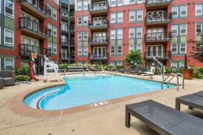 Annapolis apartment for rent - A small pool in front of a red brick building.