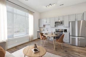 Durham apartment for rent - A modern kitchen with a dining table and chairs.