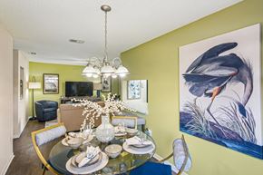 Rockledge apartment for rent - A dining room with a glass table set for a meal.