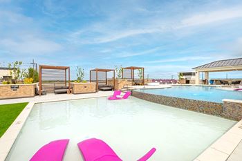 Rooftop salt-water pool with wi-fi sundeck grilling cabanas and lounge areas with yard games