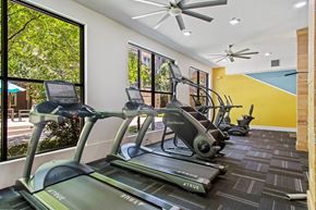 Frisco apartment for rent - A gym with treadmills and exercise bikes.