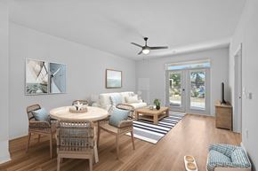 Knightdale townhouse for rent - A dining room with a round table and chairs.