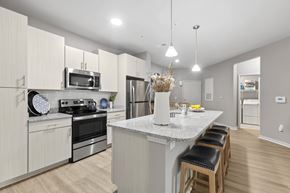 Clearwater apartment for rent - A kitchen with a white countertop and stainless steel appliances.