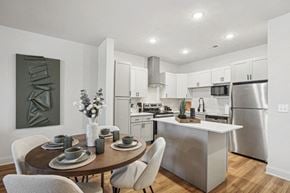 Monroe apartment for rent - A modern kitchen with a dining table set for two.