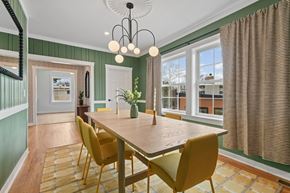 Rockville apartment for rent - A dining room with a wooden table and yellow chairs.