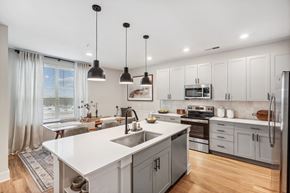 Pittsboro apartment for rent - a kitchen with white cabinets and a white counter top