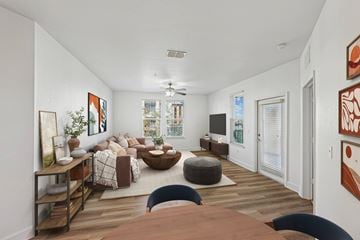 Orlando apartment for rent - A living room with a brown table and a blue chair.