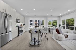 Englewood Cliffs apartment for rent - A modern kitchen with a dining area and a view of the city.