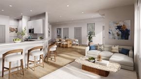 Roseland triplex for rent - A modern living room with a kitchen area in the background.