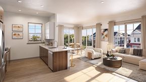 Roseland triplex for rent - A modern kitchen with a large island and a dining area with a view of the backyard.
