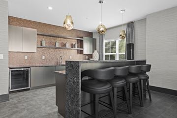 Florham Park apartment for rent - A modern kitchen with a bar area and stools.