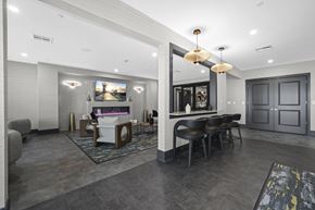 Florham Park apartment for rent - Resident lounge with a grey and white color scheme.