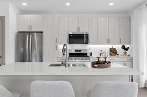 Englewood Cliffs apartment for rent - A modern kitchen with a white countertop and stainless steel appliances.