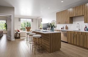 Florham Park apartment for rent - A modern kitchen with wooden cabinets and a central island.