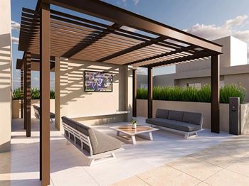 Rooftop lounge with pergola and outdoor tv