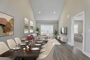 Basking Ridge apartment for rent - A modern dining room with a long table set for a meal.